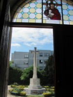 main door with war memorial and Jenny Weineck window